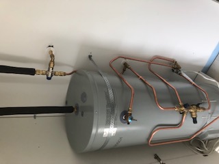 In cupboard hot water cylinder ( open )